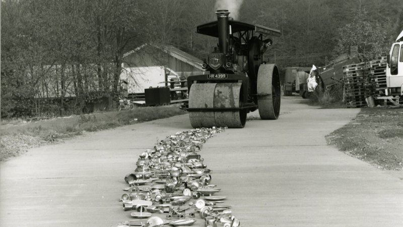 steamroller flattening sliverware